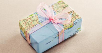 World map Christmas wrapping paper on a present for Christmas around the world lesson ideas and resources
