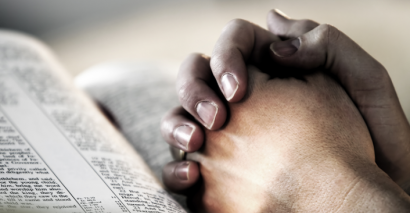 Praying Hands Representing Secondary School RE Assessments For KS3 and KS4